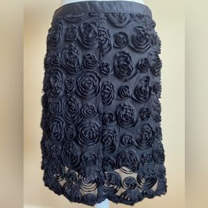 Willie Smith sheer black dressy mini skirt w/lining and ruffled flower design